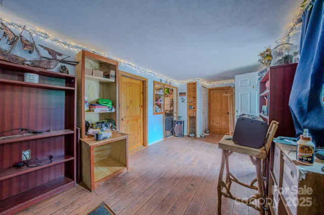 a room with furniture and wooden floor