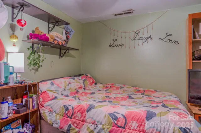 a backyard of a house with yard and trampoline