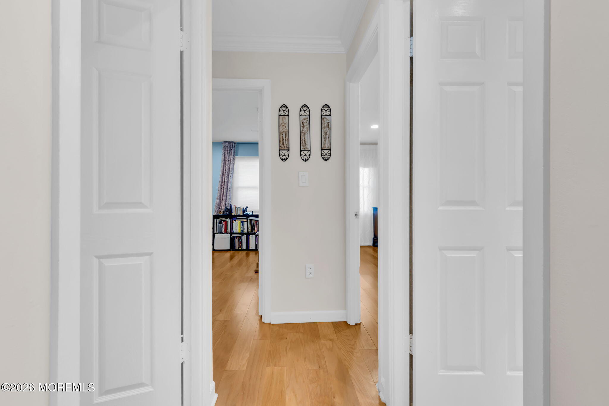 101 Andover Lane Matawan, NJ 07747 - Photo 28 of 51 a view of a hallway with wooden floor and a living room