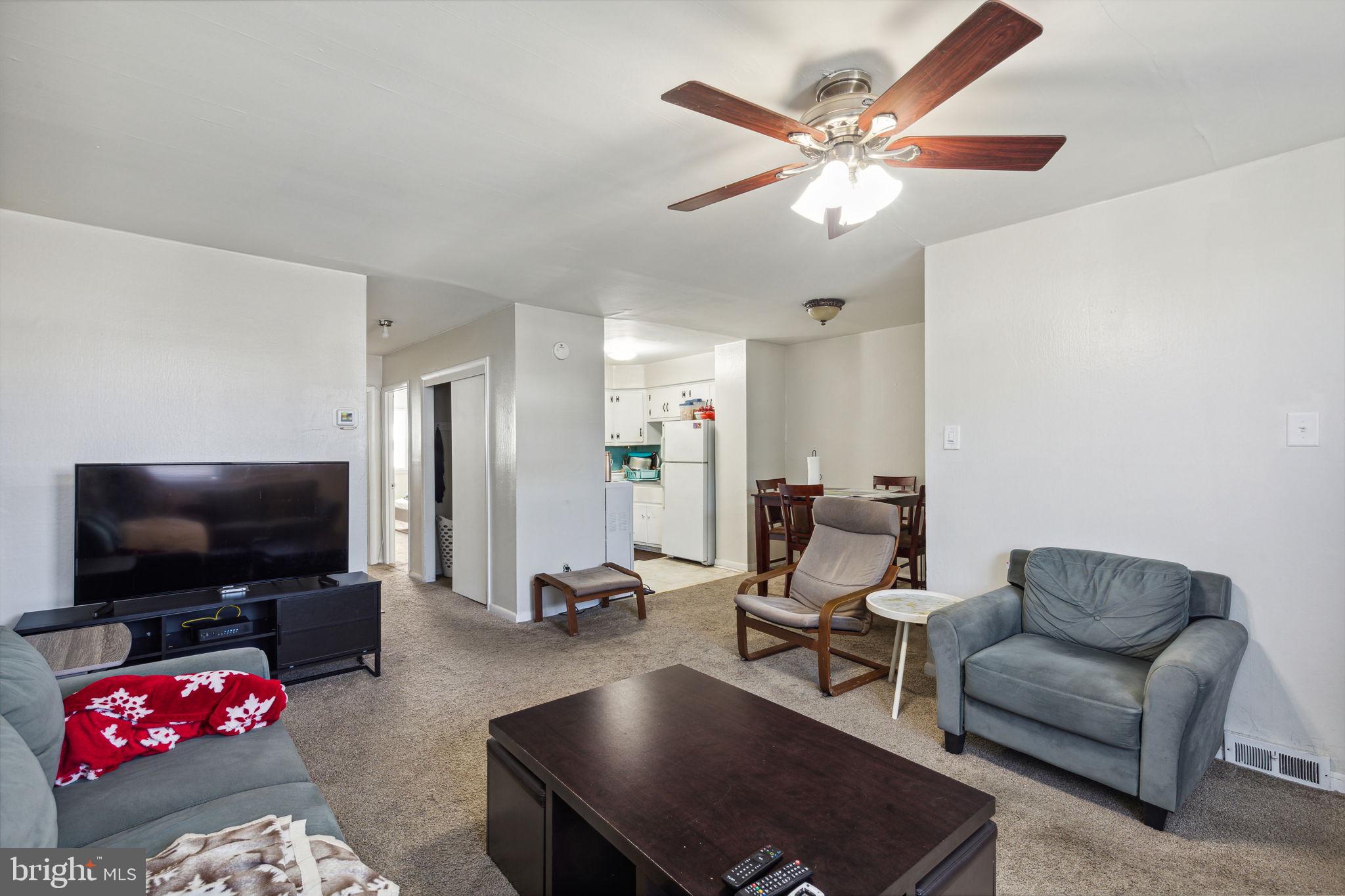 392 Beverly Boulevard Upper Darby, PA 19082 - Photo 12 of 26 a living room with furniture and a flat screen tv