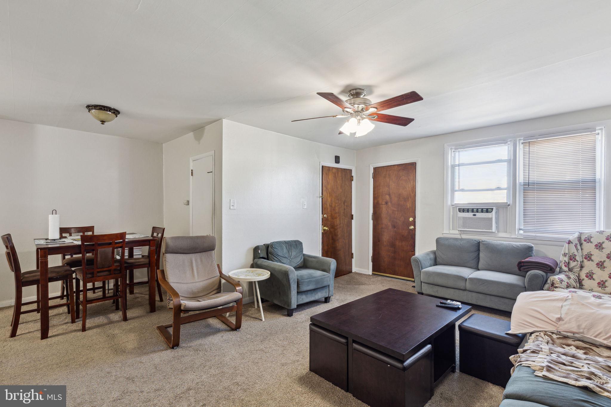 392 Beverly Boulevard Upper Darby, PA 19082 - Photo 13 of 26 a living room with furniture a table and a large window