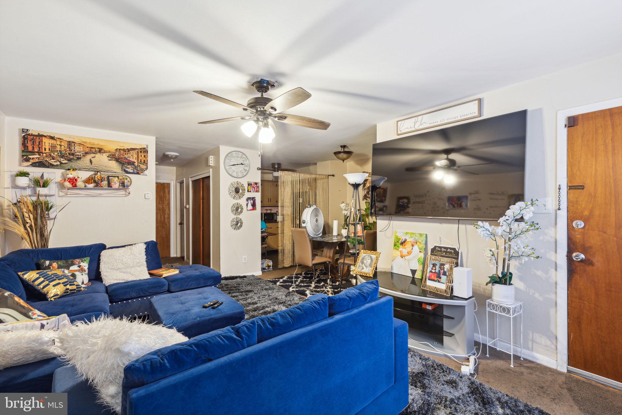 392 Beverly Boulevard Upper Darby, PA 19082 - Photo 16 of 26 a living room with furniture and a flat screen tv