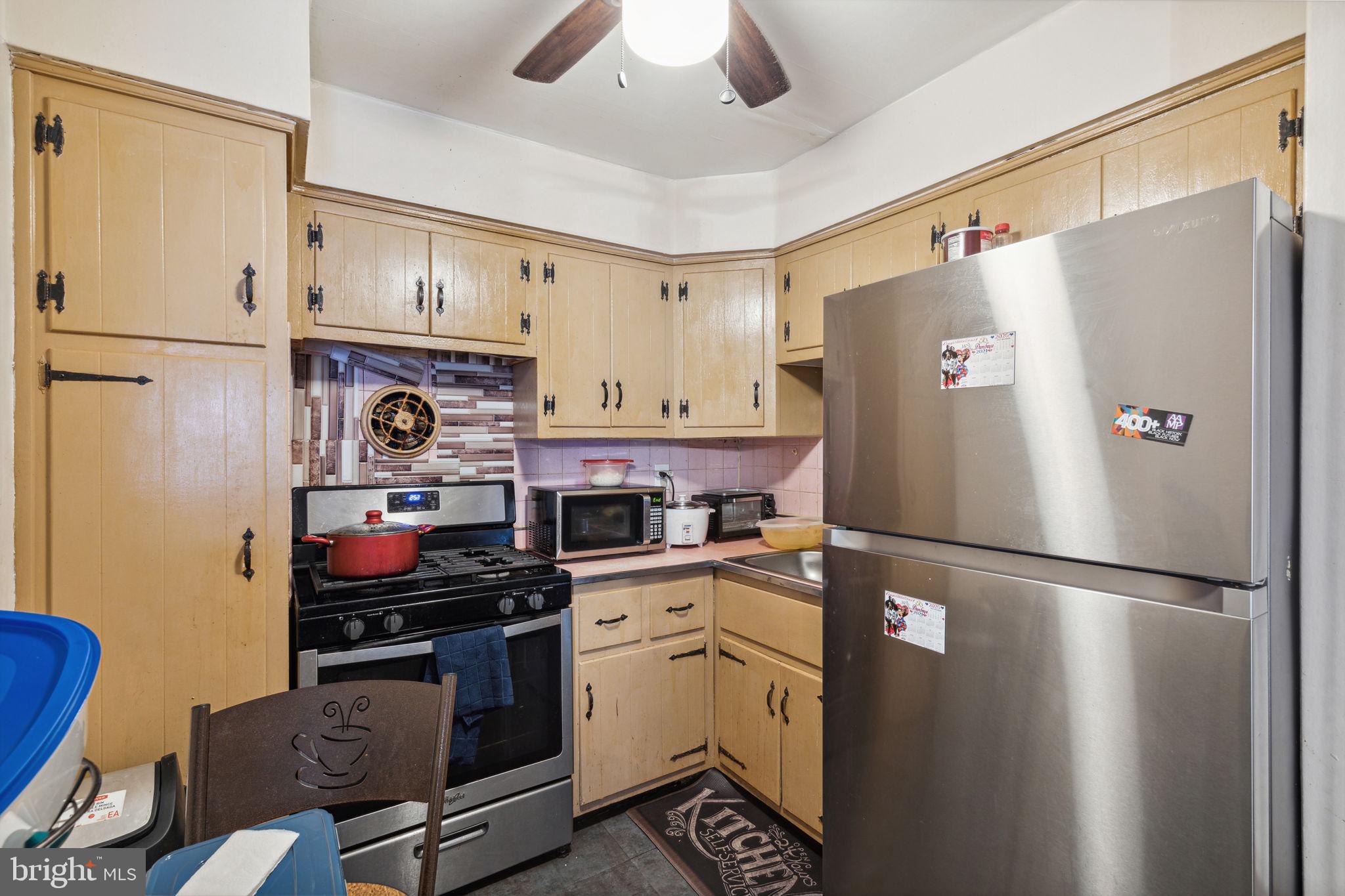 392 Beverly Boulevard Upper Darby, PA 19082 - Photo 17 of 26 a kitchen with stainless steel appliances a refrigerator and a stove
