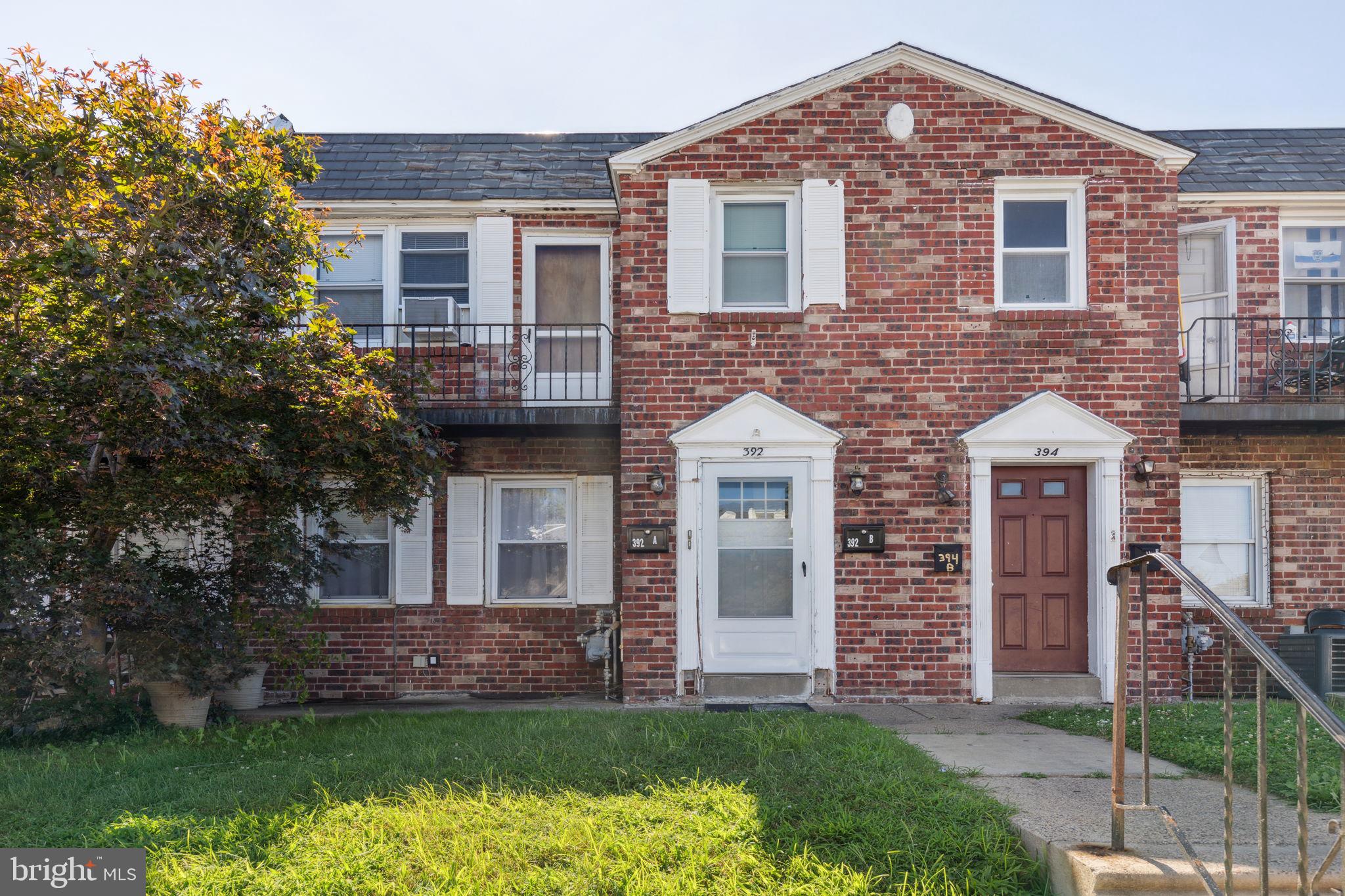 392 Beverly Boulevard Upper Darby, PA 19082 - Photo 2 of 26 front view of a house with a yard