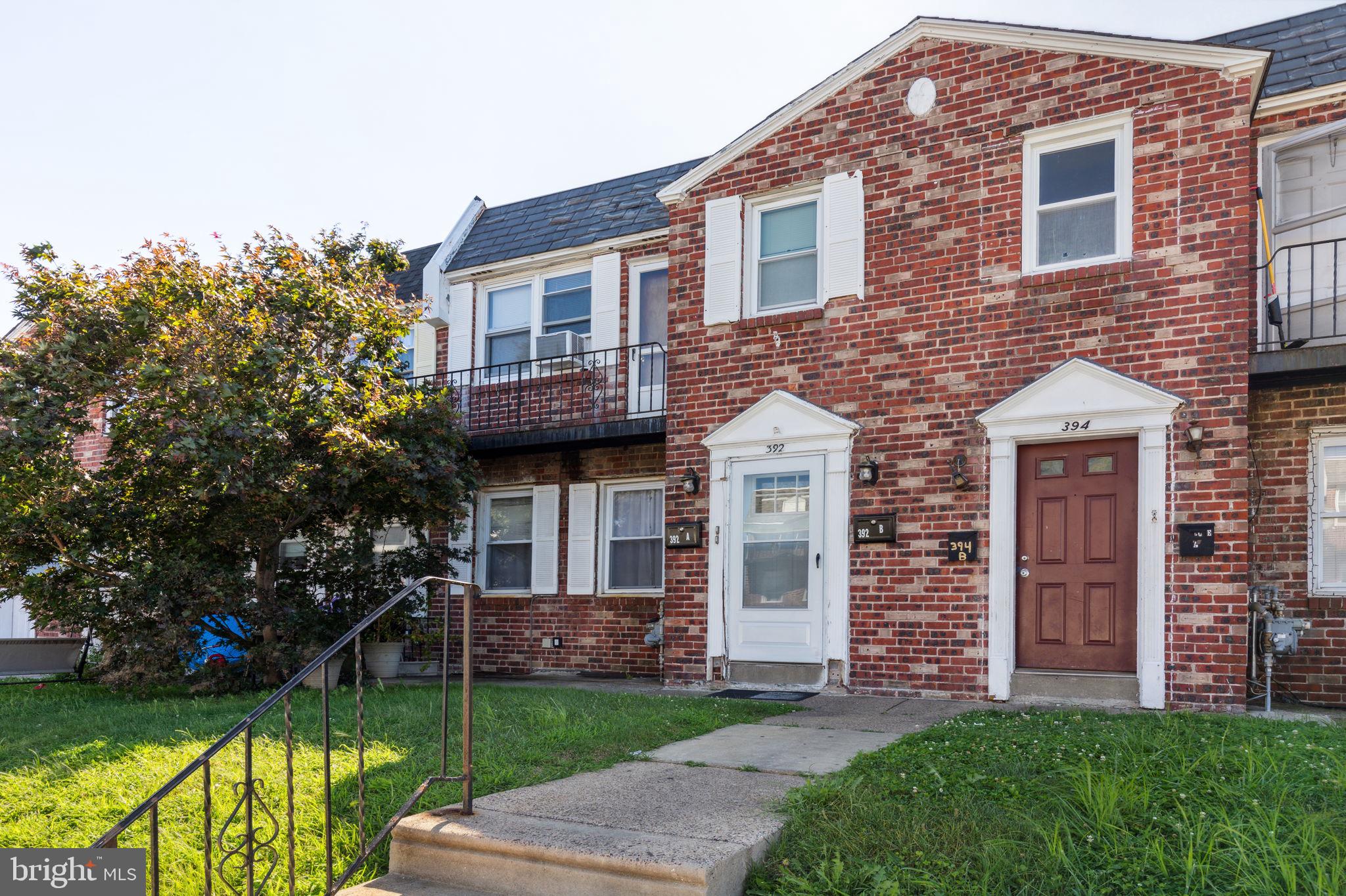 392 Beverly Boulevard Upper Darby, PA 19082 - Photo 3 of 26 a front view of a house with garden