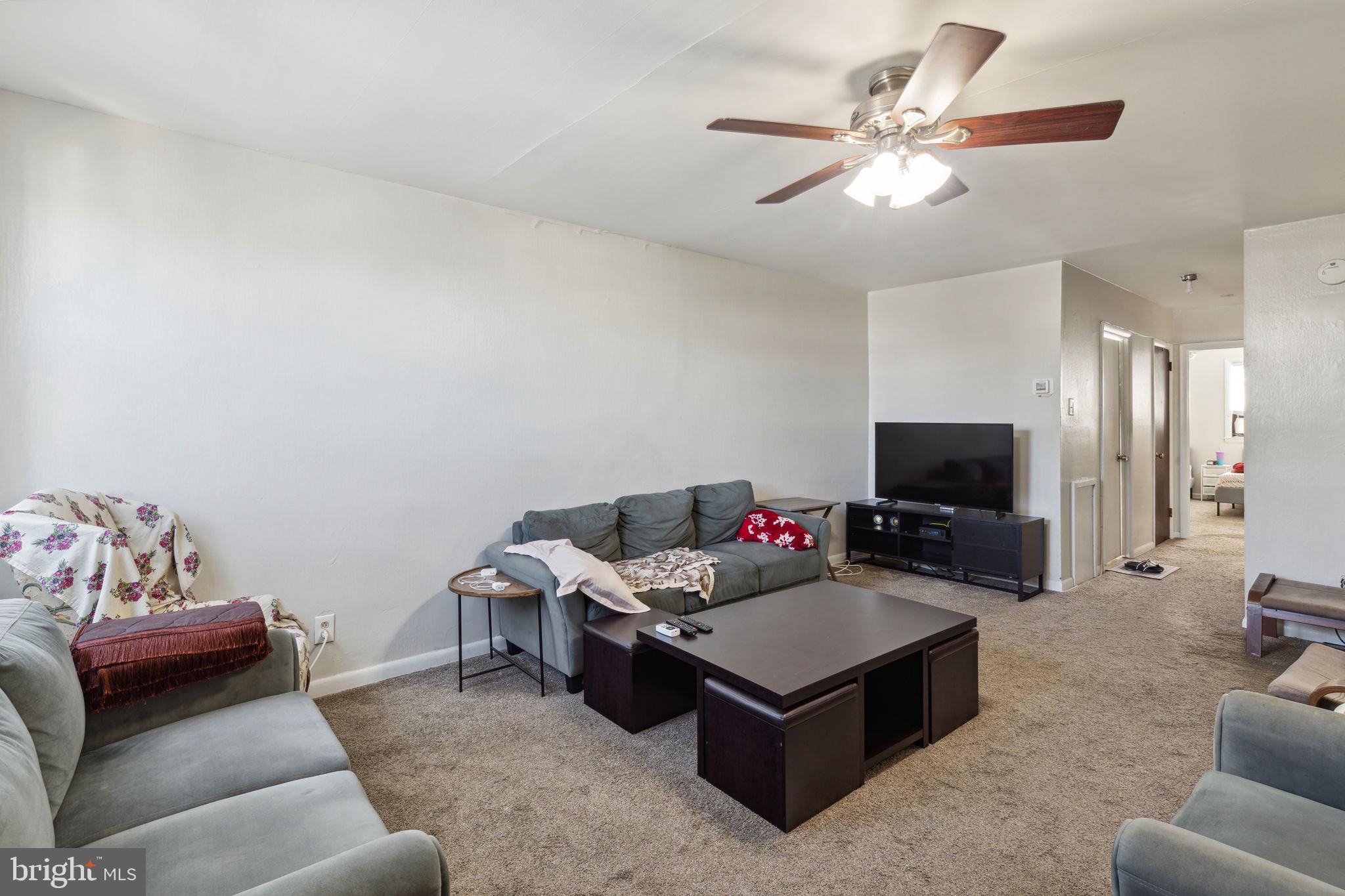 392 Beverly Boulevard Upper Darby, PA 19082 - Photo 4 of 26 a living room with furniture and a flat screen tv