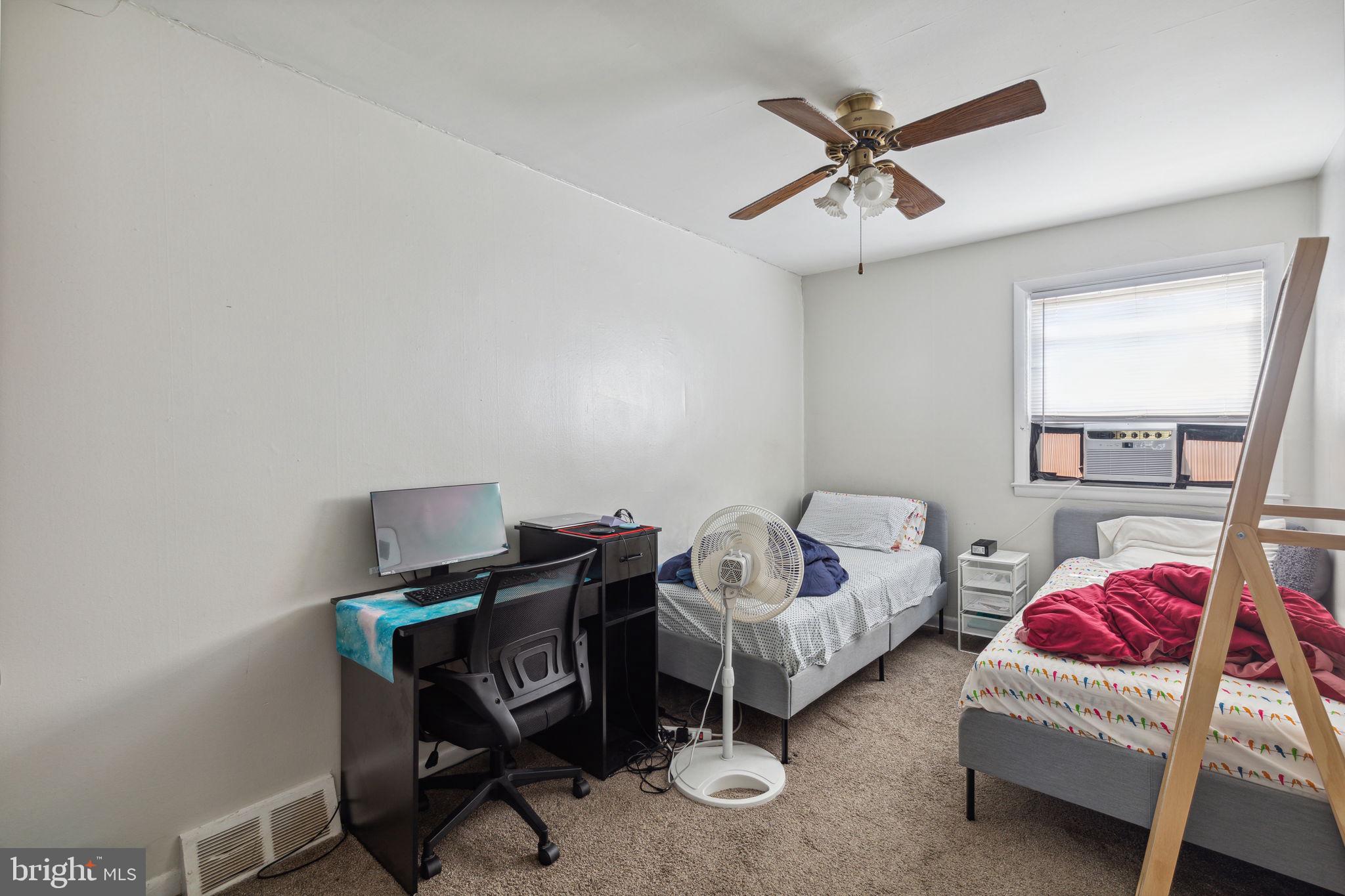 392 Beverly Boulevard Upper Darby, PA 19082 - Photo 6 of 26 a bedroom with furniture and a window