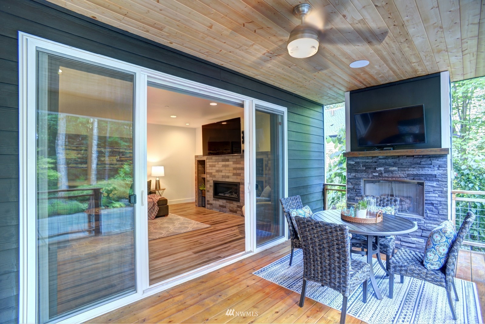 17720 190th Avenue Southeast Renton, WA 98058 - Photo 11 of 40 a dining room with furniture and a fireplace