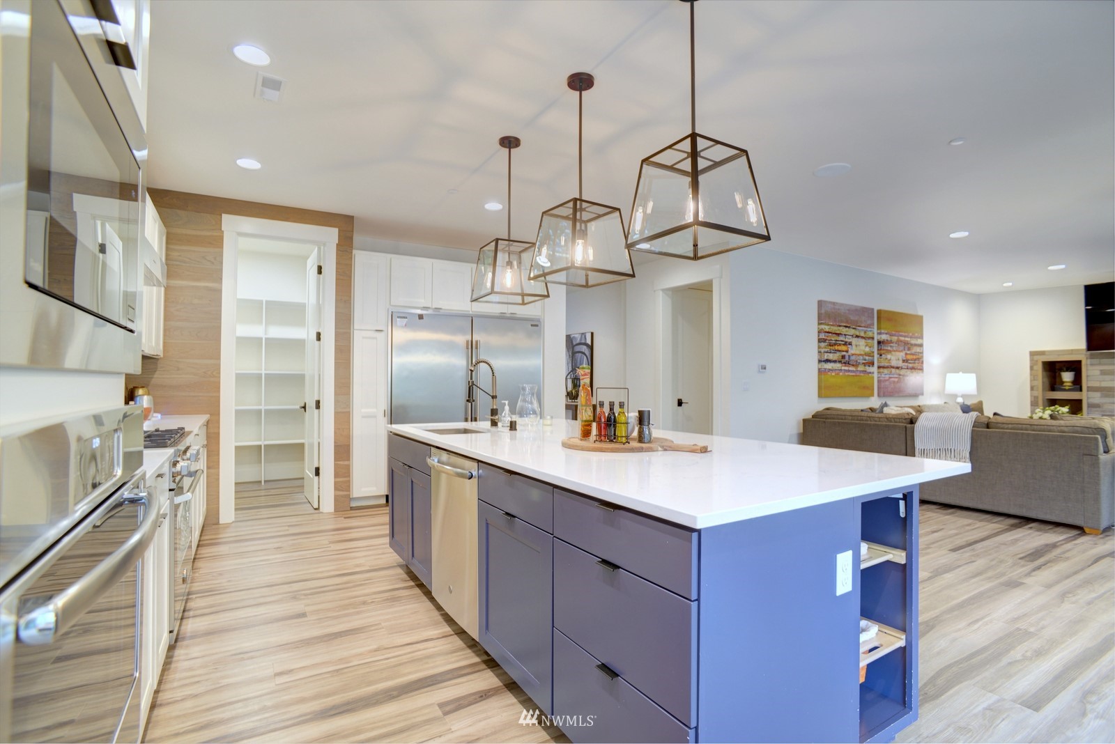 17720 190th Avenue Southeast Renton, WA 98058 - Photo 20 of 40 a kitchen with kitchen island a sink wooden floor and white appliances
