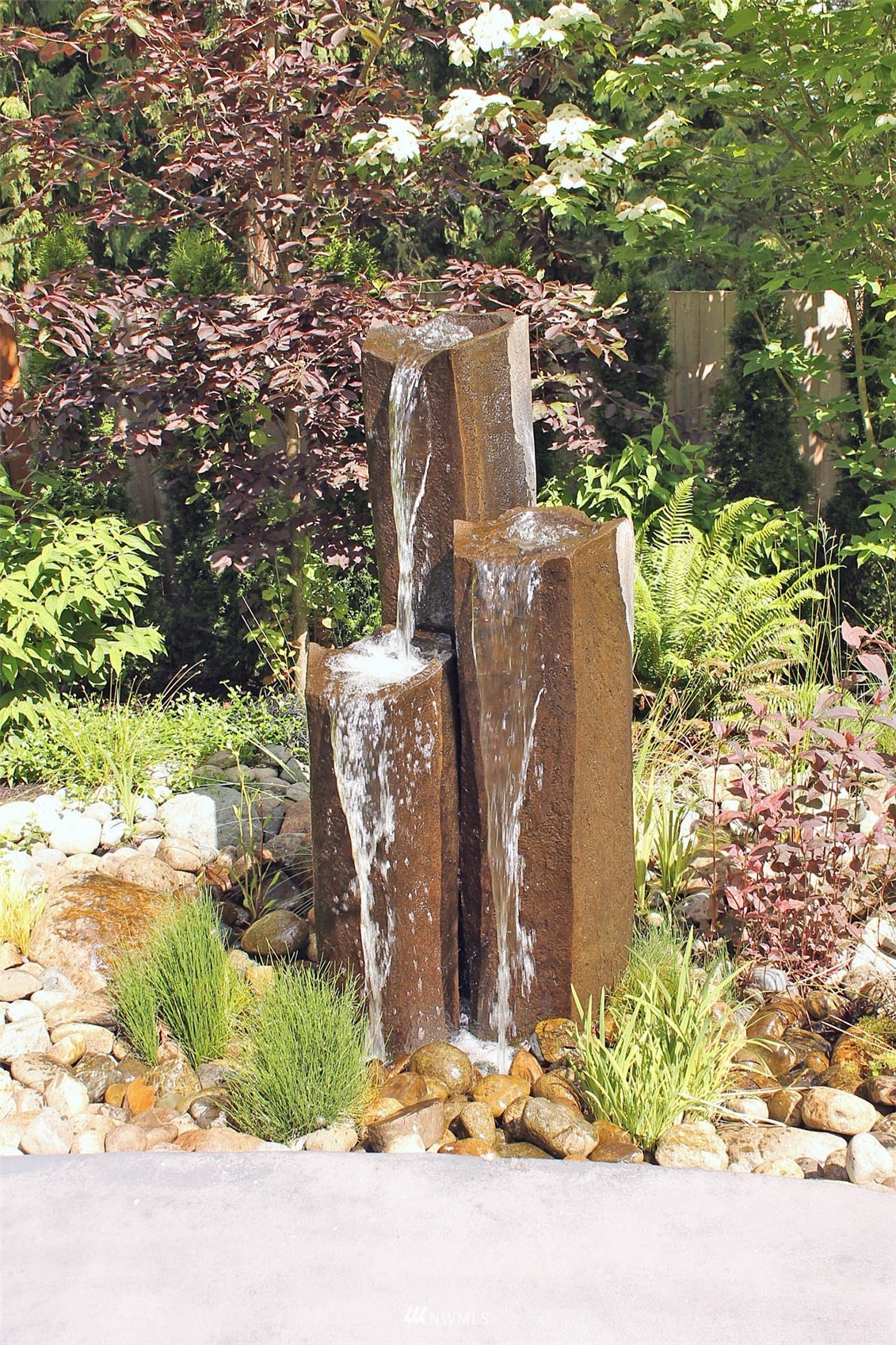 17720 190th Avenue Southeast Renton, WA 98058 - Photo 37 of 40 a view of a garden with a tree