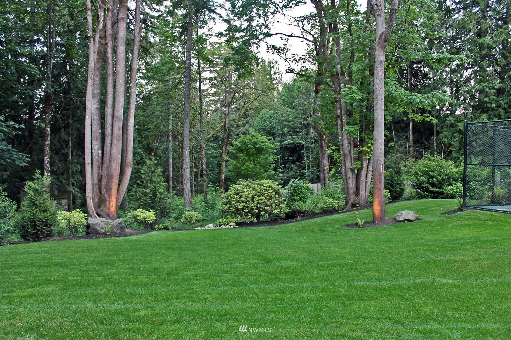 17720 190th Avenue Southeast Renton, WA 98058 - Photo 39 of 40 a view of a garden with plants and large trees