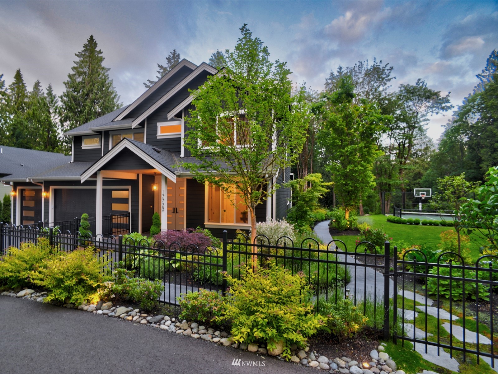 17720 190th Avenue Southeast Renton, WA 98058 - Photo 40 of 40 a front view of a house with a yard and potted plants