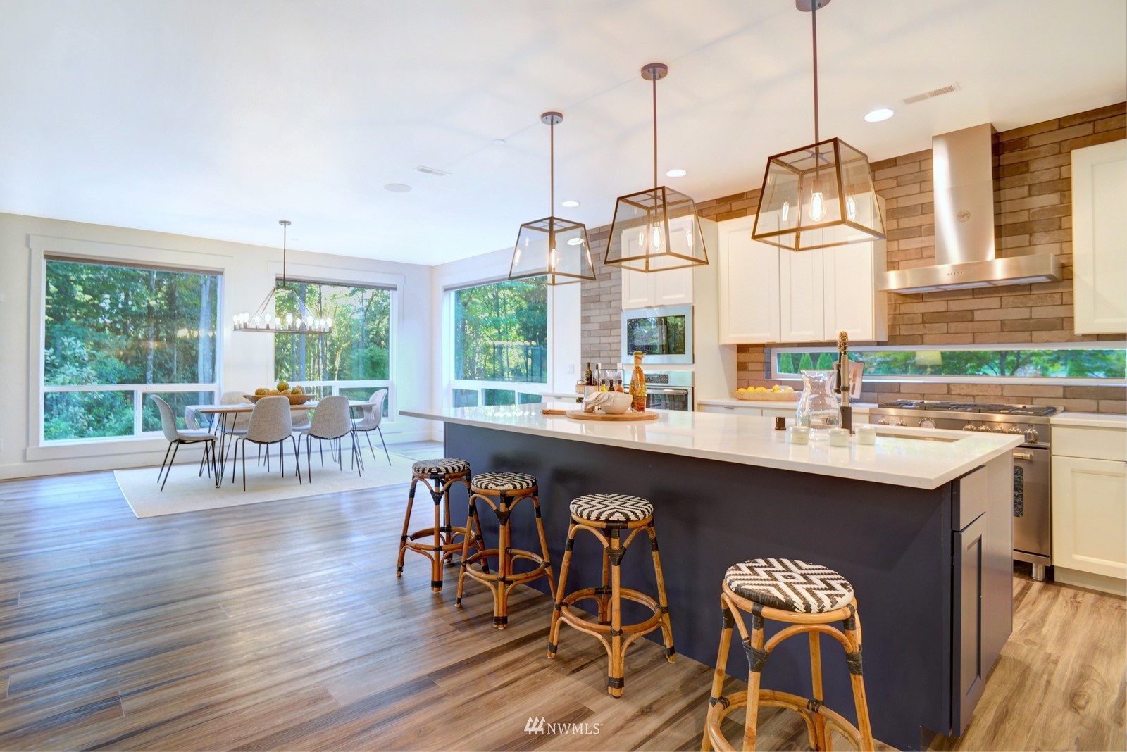 17720 190th Avenue Southeast Renton, WA 98058 - Photo 6 of 40 a kitchen with a sink a counter and chairs
