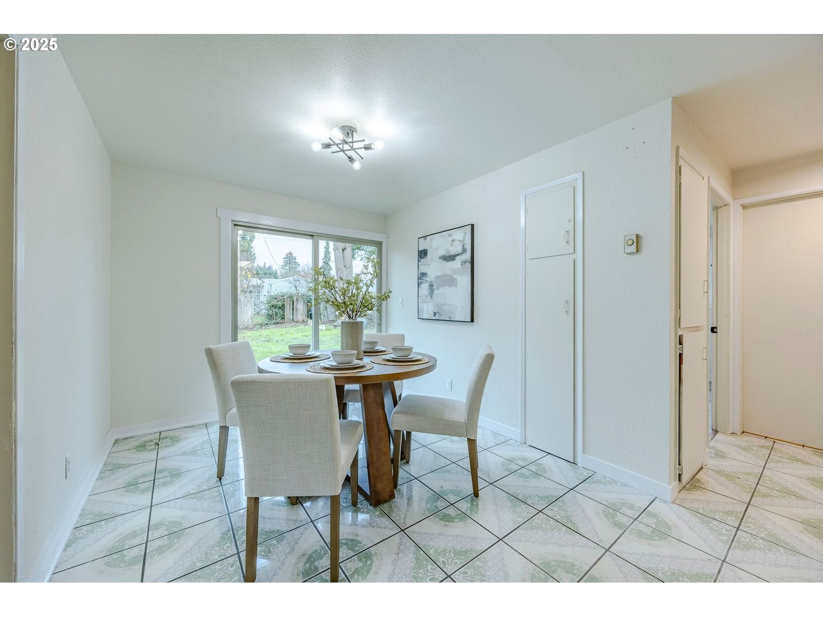 5982 G Street Springfield, OR 97478 - Photo 16 of 39 a view of a dining room with furniture and chandelier