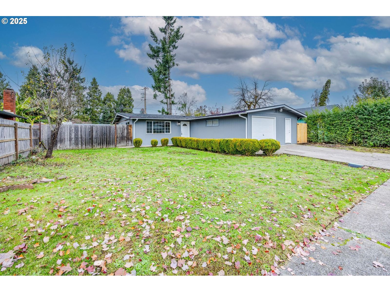 5982 G Street Springfield, OR 97478 - Photo 3 of 39 a garden covered with wooden fence