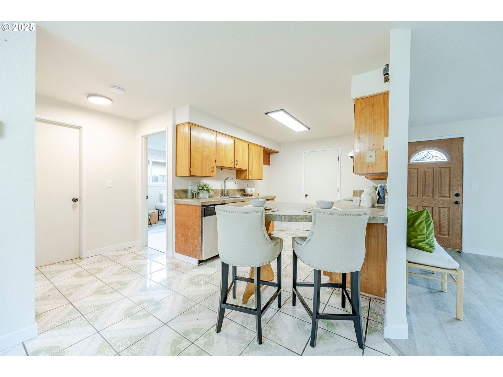 5982 G Street Springfield, OR 97478 - Photo 9 of 39 a kitchen with a table and chairs in it