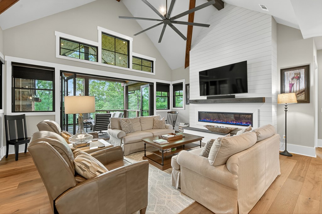 658 Old Toccoa Loop Mineral Bluff, GA 30559 - Photo 14 of 74 a living room with fireplace furniture and a flat screen tv