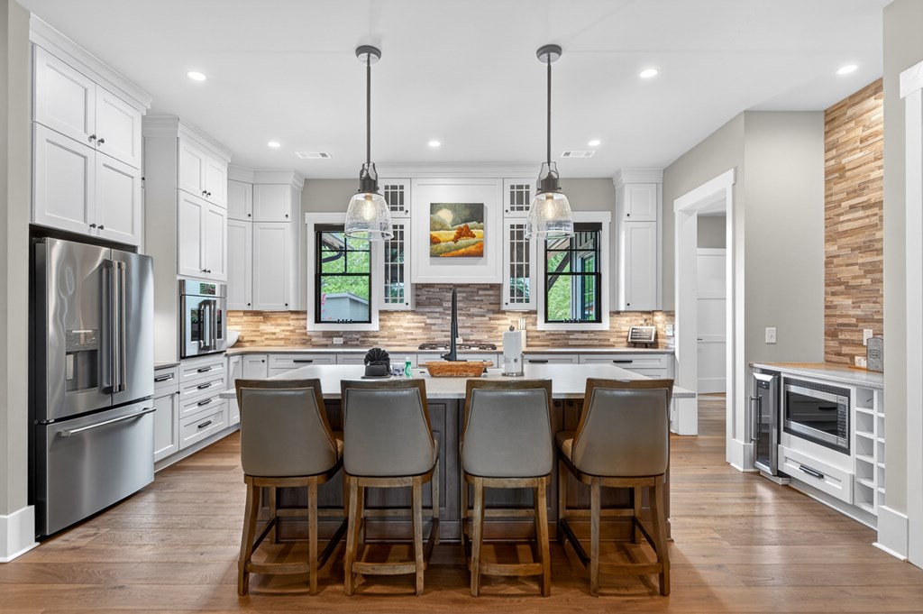 658 Old Toccoa Loop Mineral Bluff, GA 30559 - Photo 17 of 74 a kitchen with stainless steel appliances granite countertop a kitchen island a table and chairs