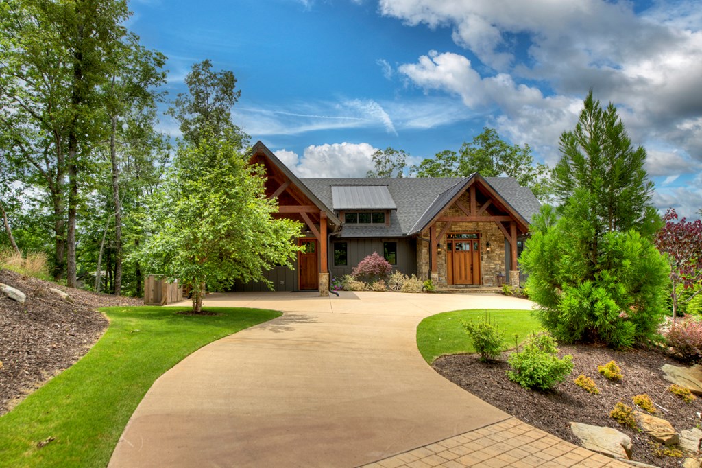 658 Old Toccoa Loop Mineral Bluff, GA 30559 - Photo 2 of 74 a front view of a house with a yard and trees