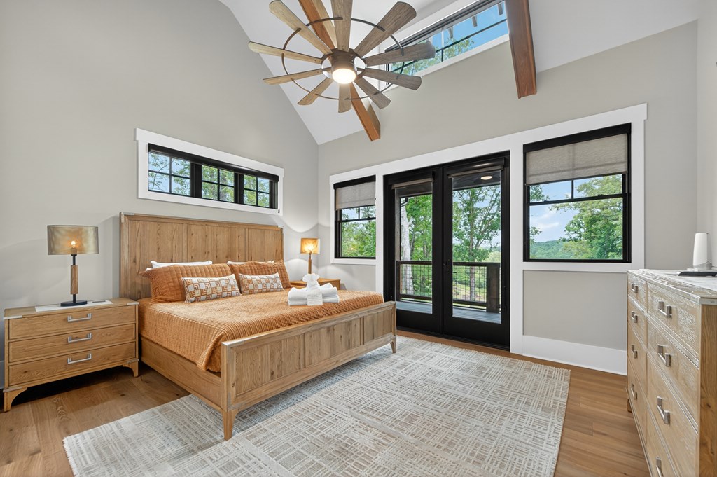658 Old Toccoa Loop Mineral Bluff, GA 30559 - Photo 26 of 74 a bedroom with a large bed and a large window