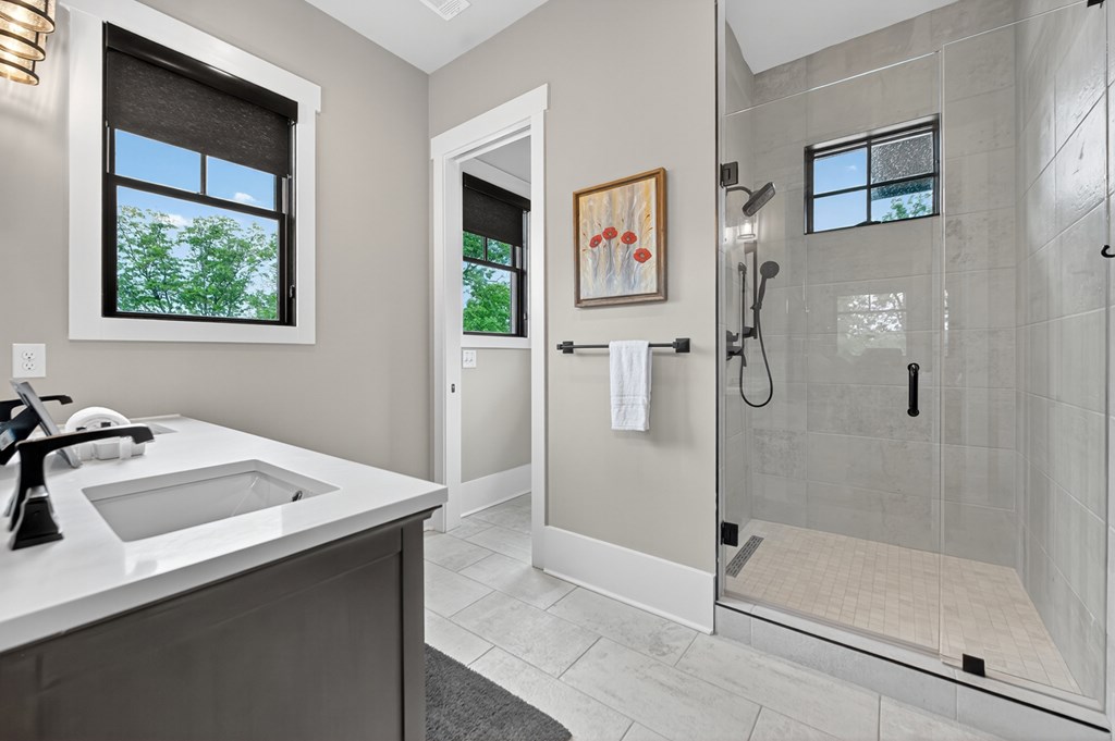 658 Old Toccoa Loop Mineral Bluff, GA 30559 - Photo 32 of 74 a bathroom with a sink a mirror and a shower