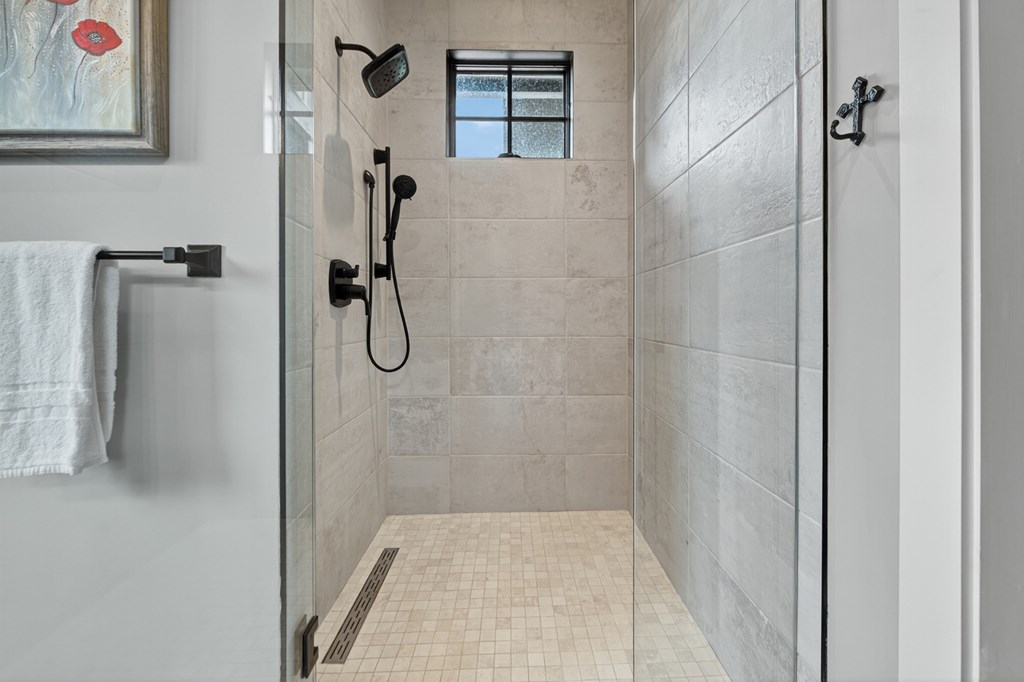 658 Old Toccoa Loop Mineral Bluff, GA 30559 - Photo 34 of 74 a bathroom with a glass shower door
