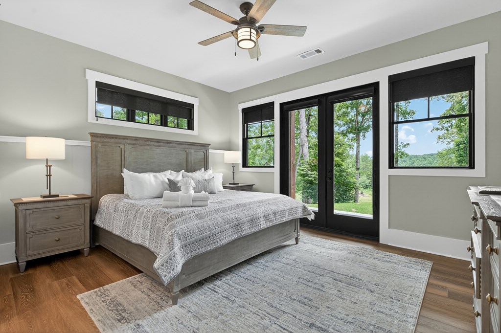 658 Old Toccoa Loop Mineral Bluff, GA 30559 - Photo 41 of 74 a bedroom with a large bed and a window