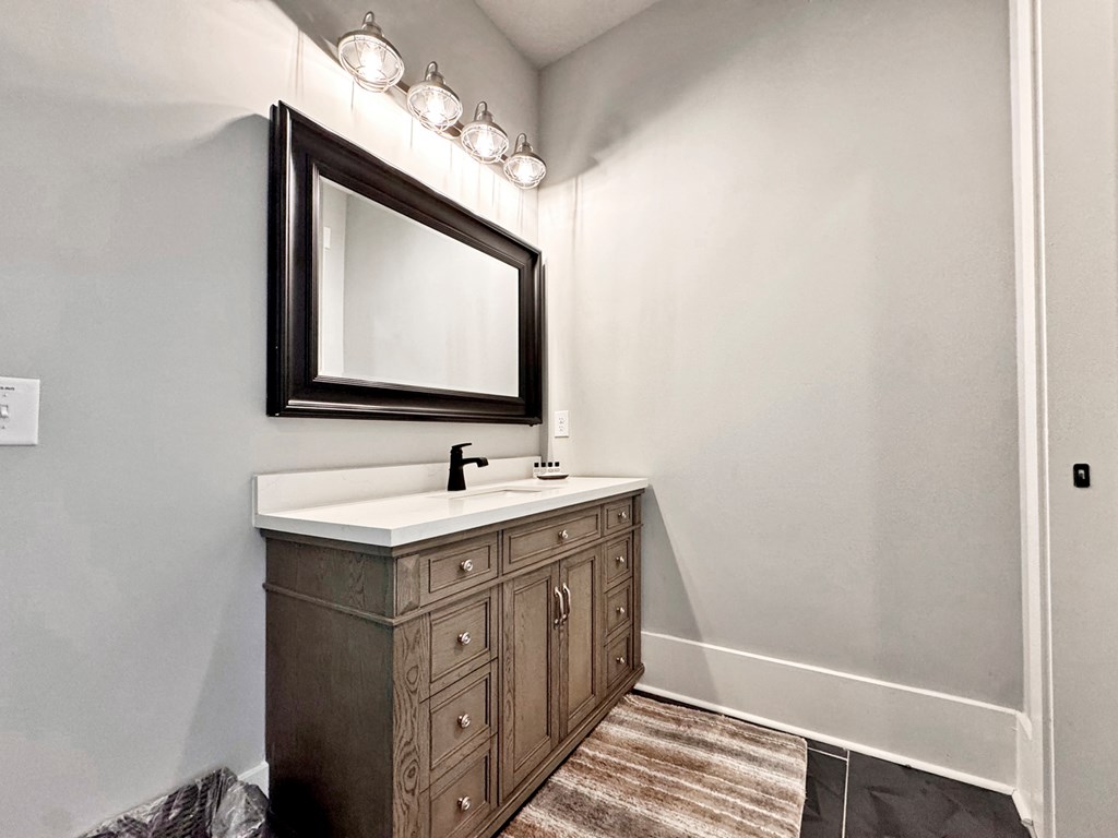 658 Old Toccoa Loop Mineral Bluff, GA 30559 - Photo 45 of 74 a bathroom with a sink a mirror and a vanity