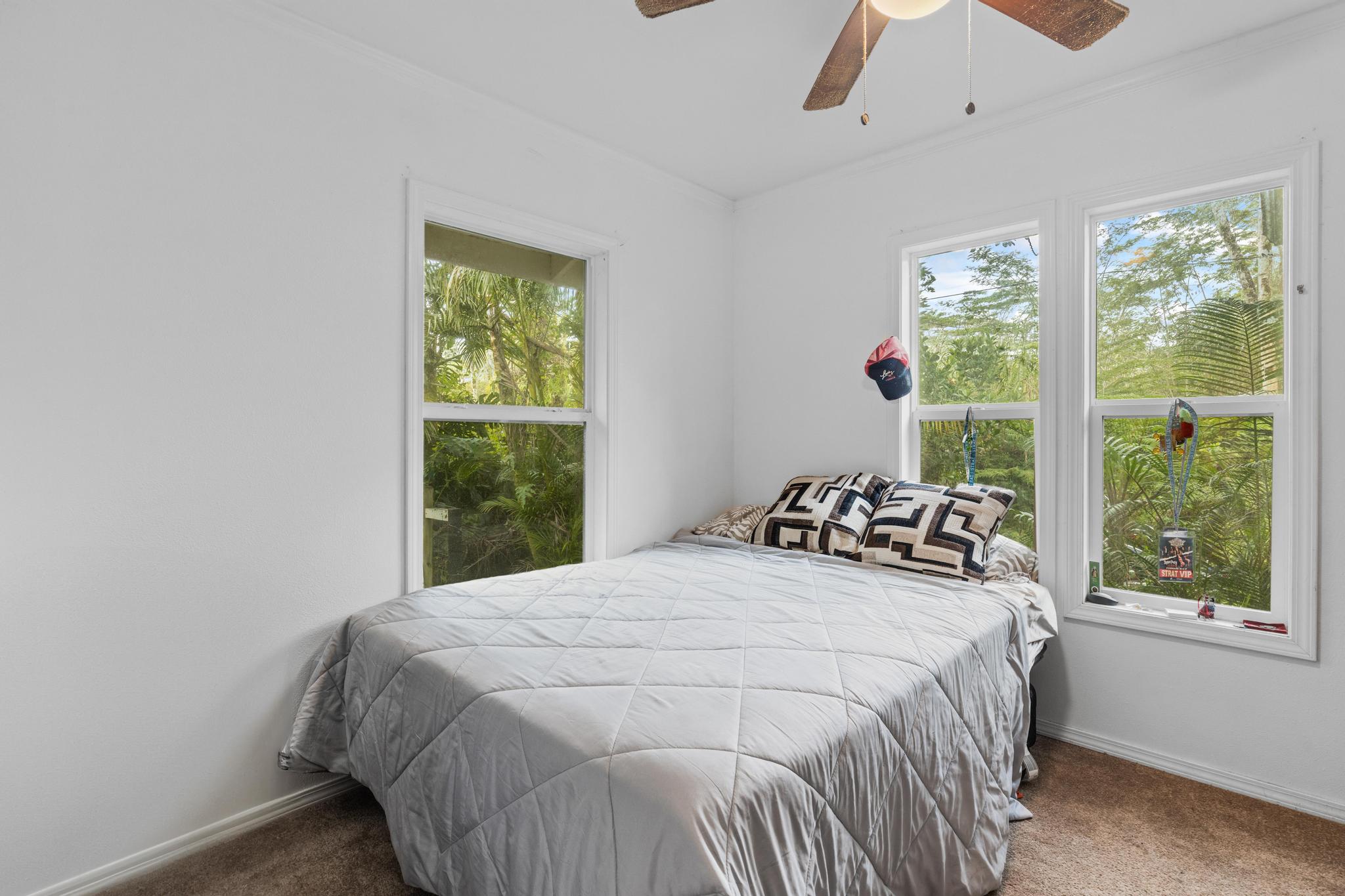 14-823 Seaview Road Pahoa, HI 96778 - Photo 12 of 23 a bedroom with a bed and a window