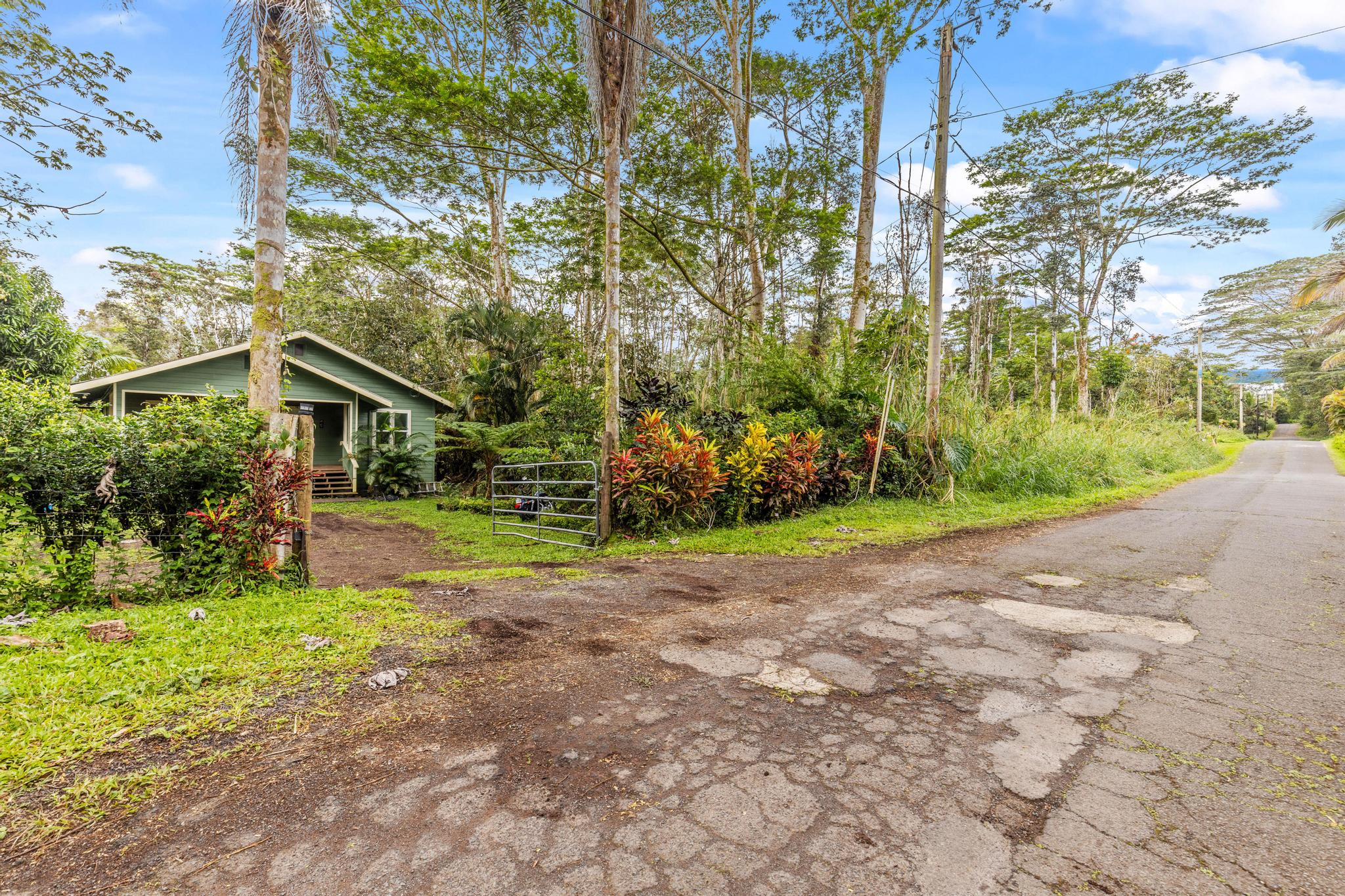 14-823 Seaview Road Pahoa, HI 96778 - Photo 18 of 23 a view of a house with a yard and tree