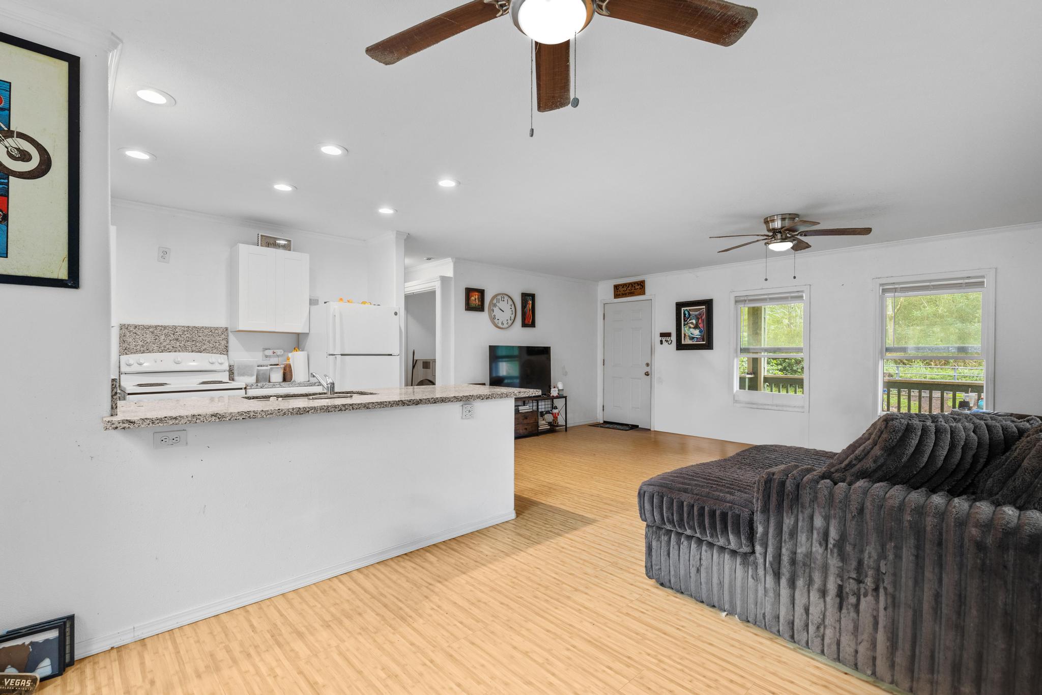 14-823 Seaview Road Pahoa, HI 96778 - Photo 5 of 23 a living room with furniture and a wooden floor
