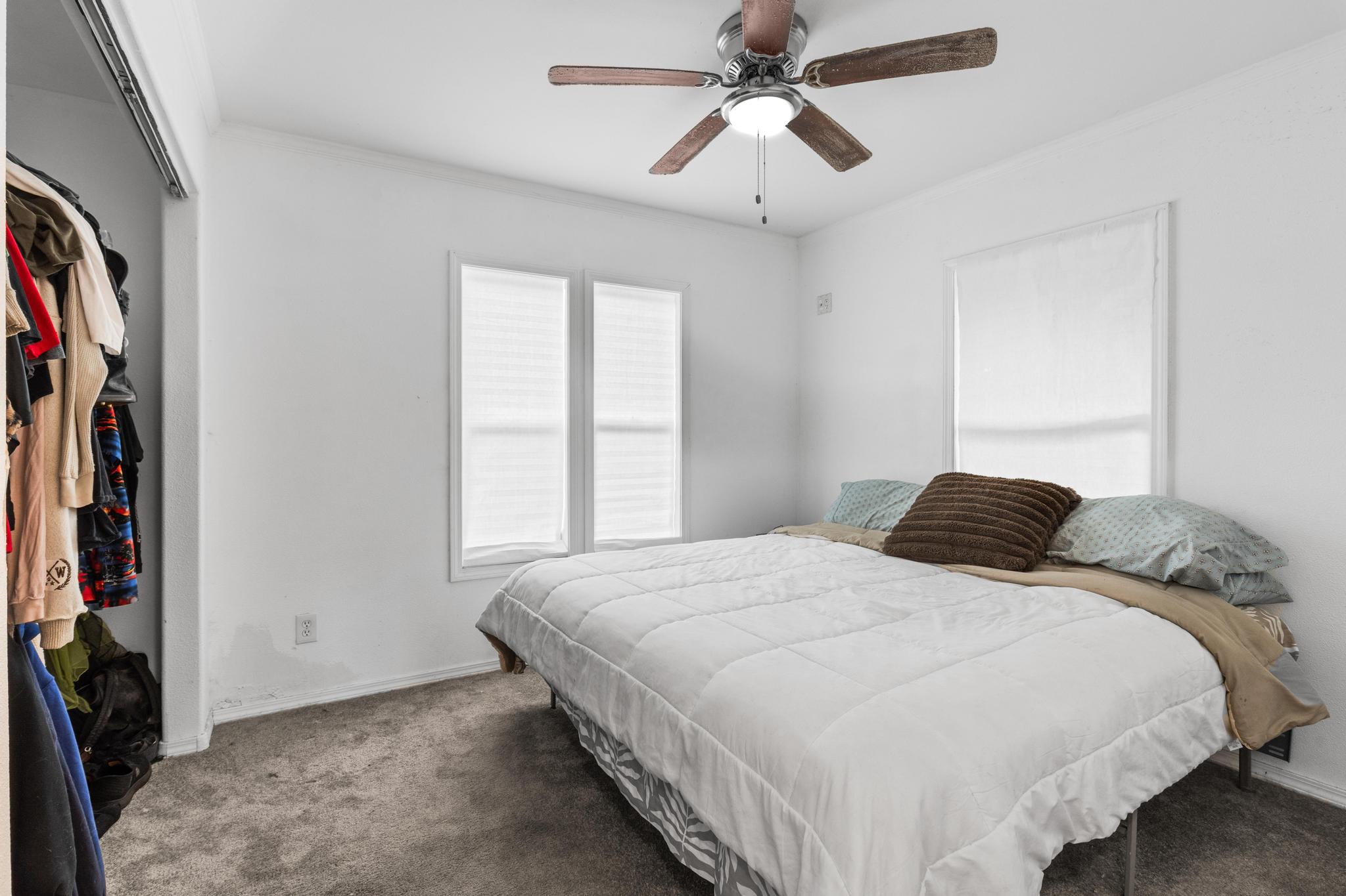 14-823 Seaview Road Pahoa, HI 96778 - Photo 10 of 23 a bedroom with a large bed and a chandelier