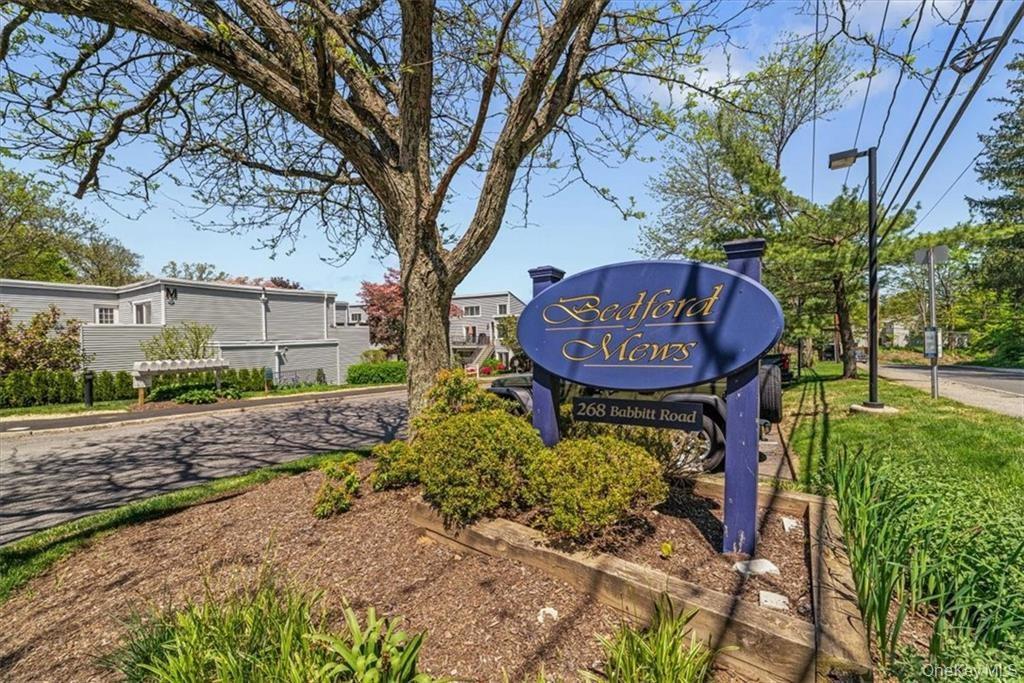 a view of a back yard with a flower garden