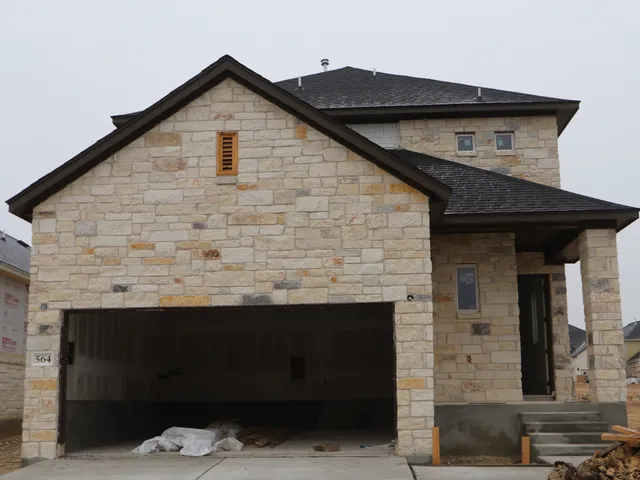 a front view of a house with garage