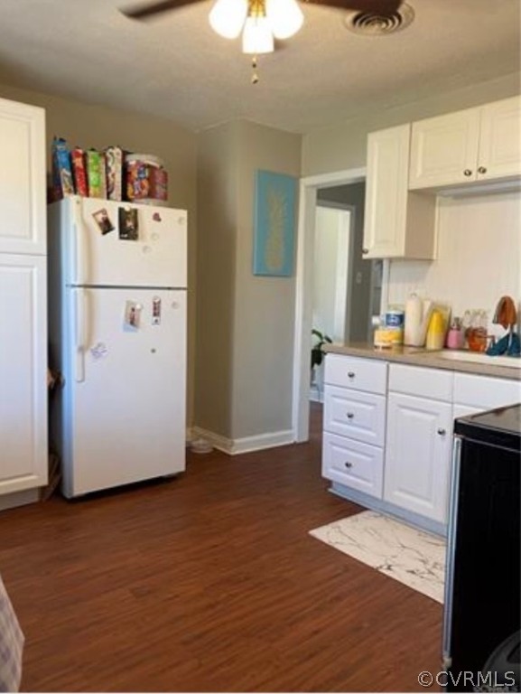 1400 Bangle Drive Richmond, VA 23224 - Photo 5 of 8 a kitchen with a refrigerator and a stove top oven