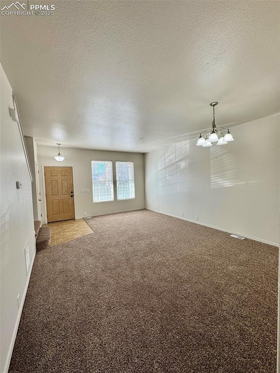 7354 Countryside Grove Fountain, CO 80817 - Photo 12 of 28 en empty room with windows and ceiling fan