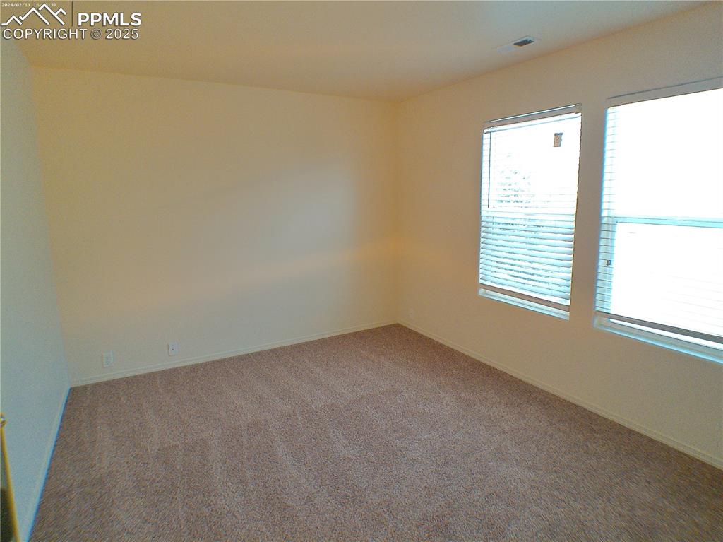 7354 Countryside Grove Fountain, CO 80817 - Photo 18 of 28 a view of an empty room with a window