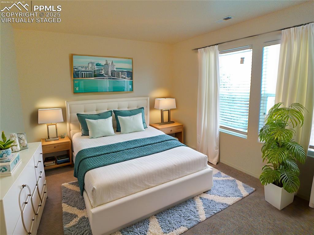 7354 Countryside Grove Fountain, CO 80817 - Photo 19 of 28 a bedroom with a bed and a window