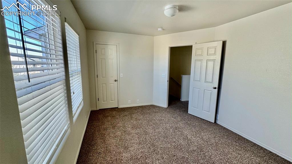 7354 Countryside Grove Fountain, CO 80817 - Photo 21 of 28 a view of hallway with closet and large window