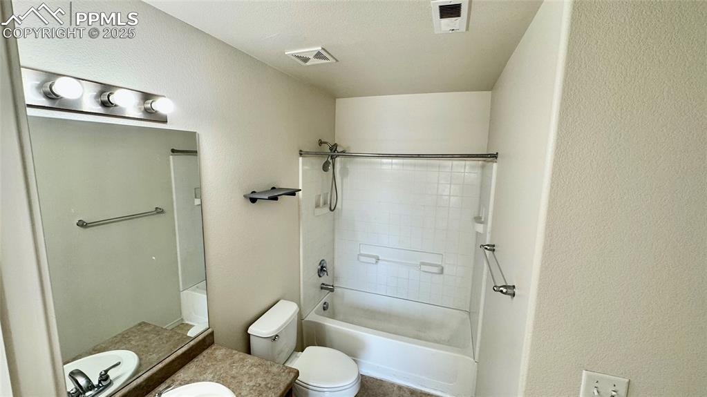 7354 Countryside Grove Fountain, CO 80817 - Photo 25 of 28 a bathroom with a granite countertop bathtub shower sink and toilet