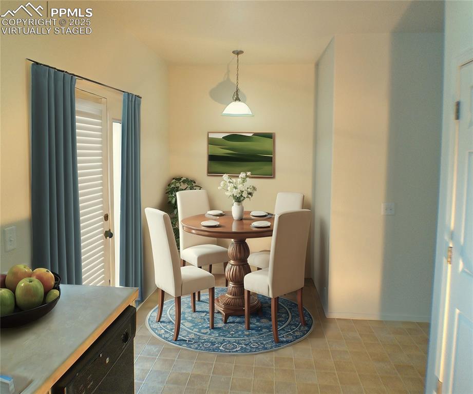 7354 Countryside Grove Fountain, CO 80817 - Photo 10 of 28 a dining room with furniture and wooden floor
