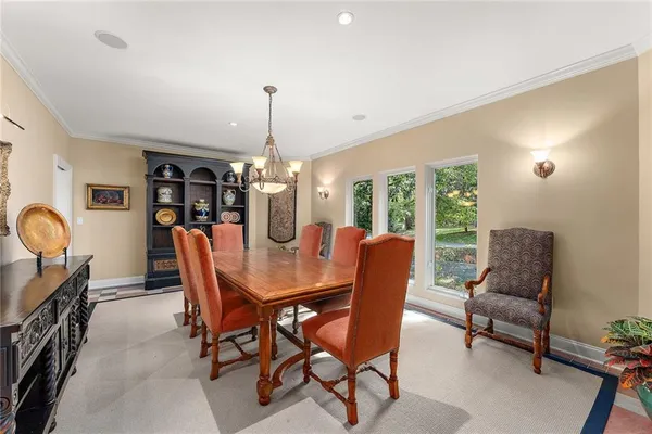 a view of a dining room with furniture window and outside view