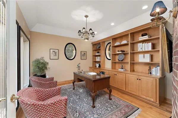 a living room with furniture a rug and a window