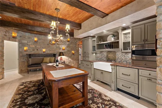 a kitchen with a sink and cabinets