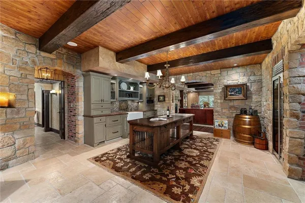 a kitchen with refrigerator and cabinets