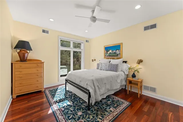 a bed room with a bed and a dresser