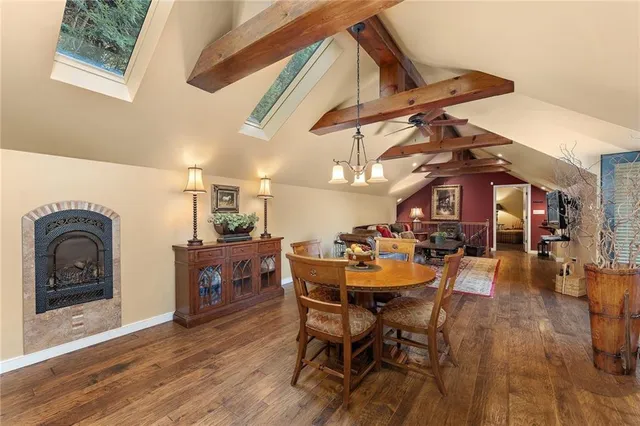 a dining room with furniture and wooden floor