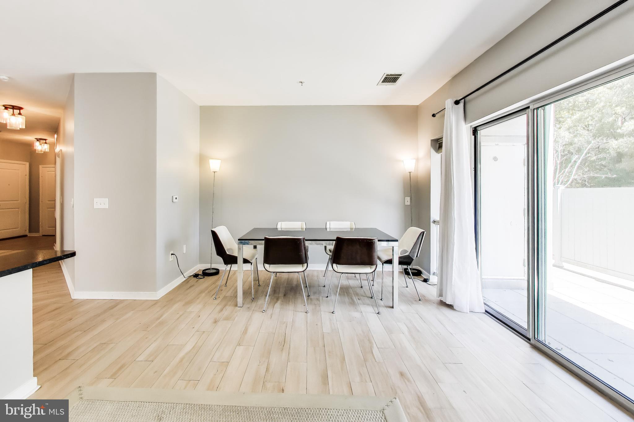 8045 Newell Street, Unit 118 Silver Spring, MD 20910 - Photo 14 of 39 Living Dining Area