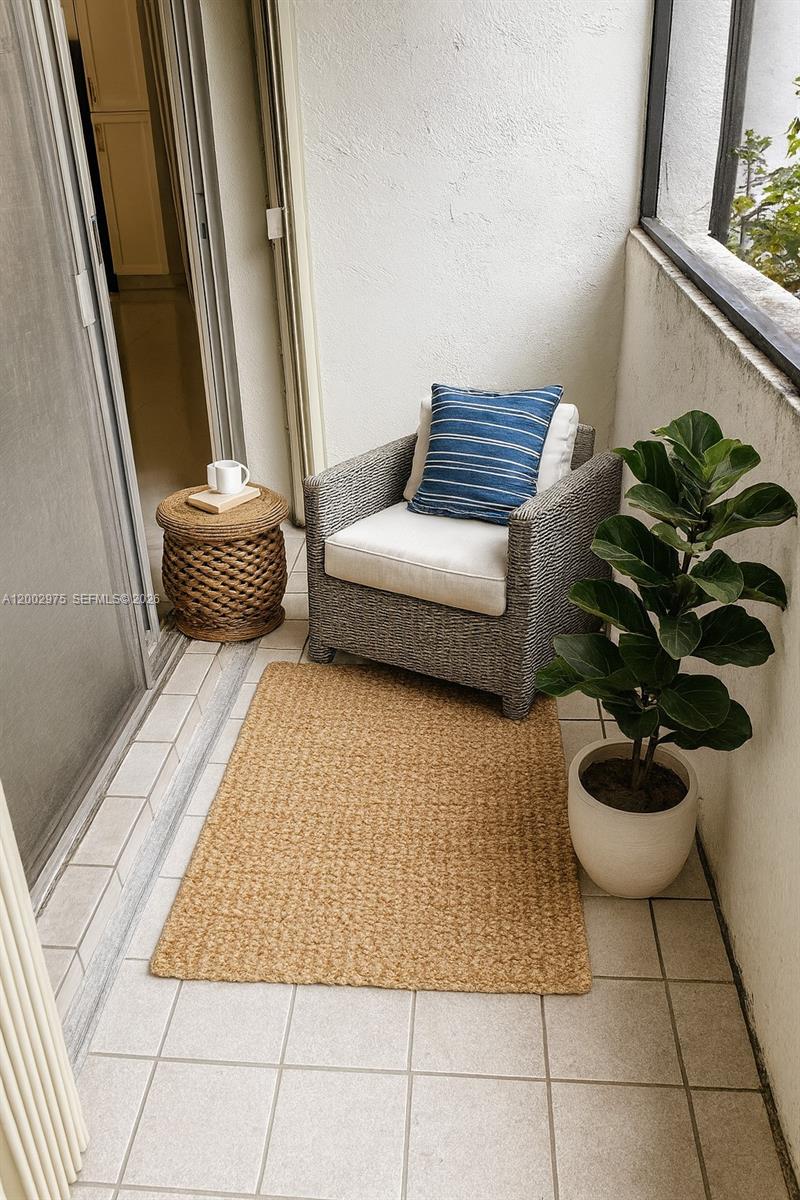 9350 Southwest 77th Avenue, Unit G1 Miami, FL 33156 - Photo 35 of 36 Virtually staged screened balcony.