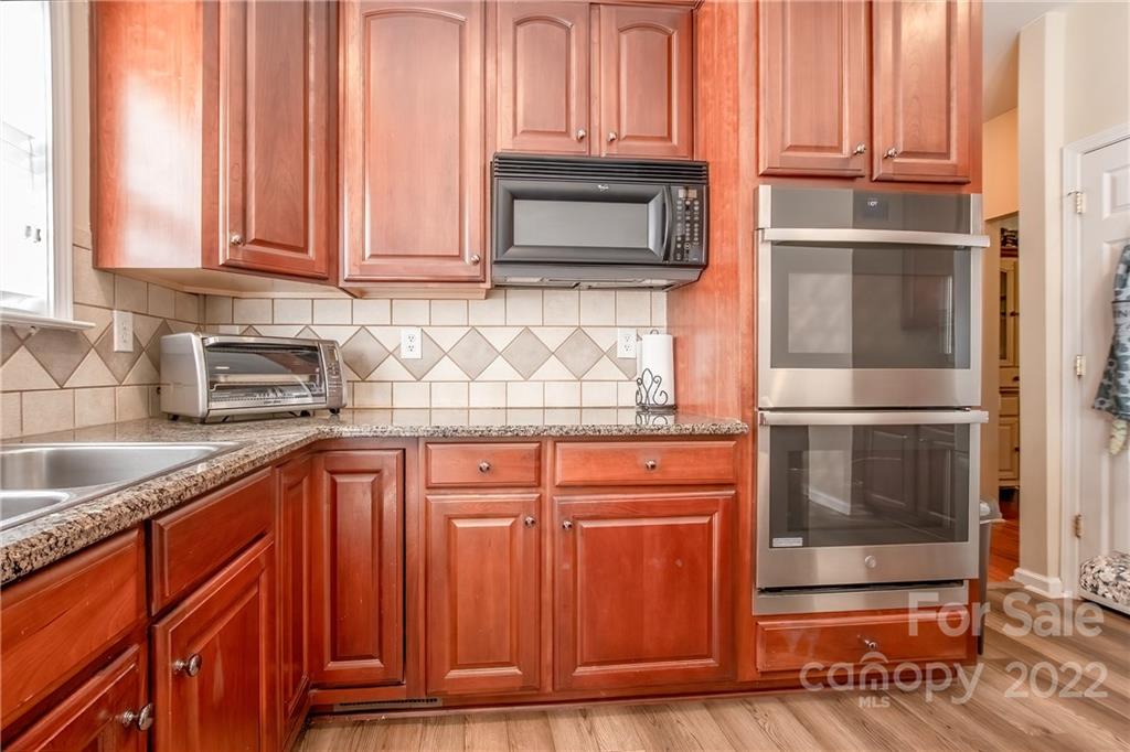 5511 Alexandrite Way Fort Mill, SC 29708 - Photo 11 of 32 a kitchen with stainless steel appliances granite countertop a refrigerator and cabinets